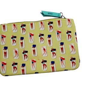 Ipsy make-up bag, zipper closure in a fun yellow and swimsuit design.